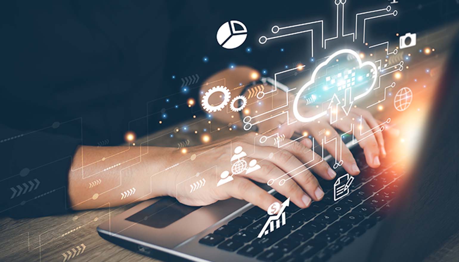Close-up picture of someone typing on a laptop with cloud icon hovering above.